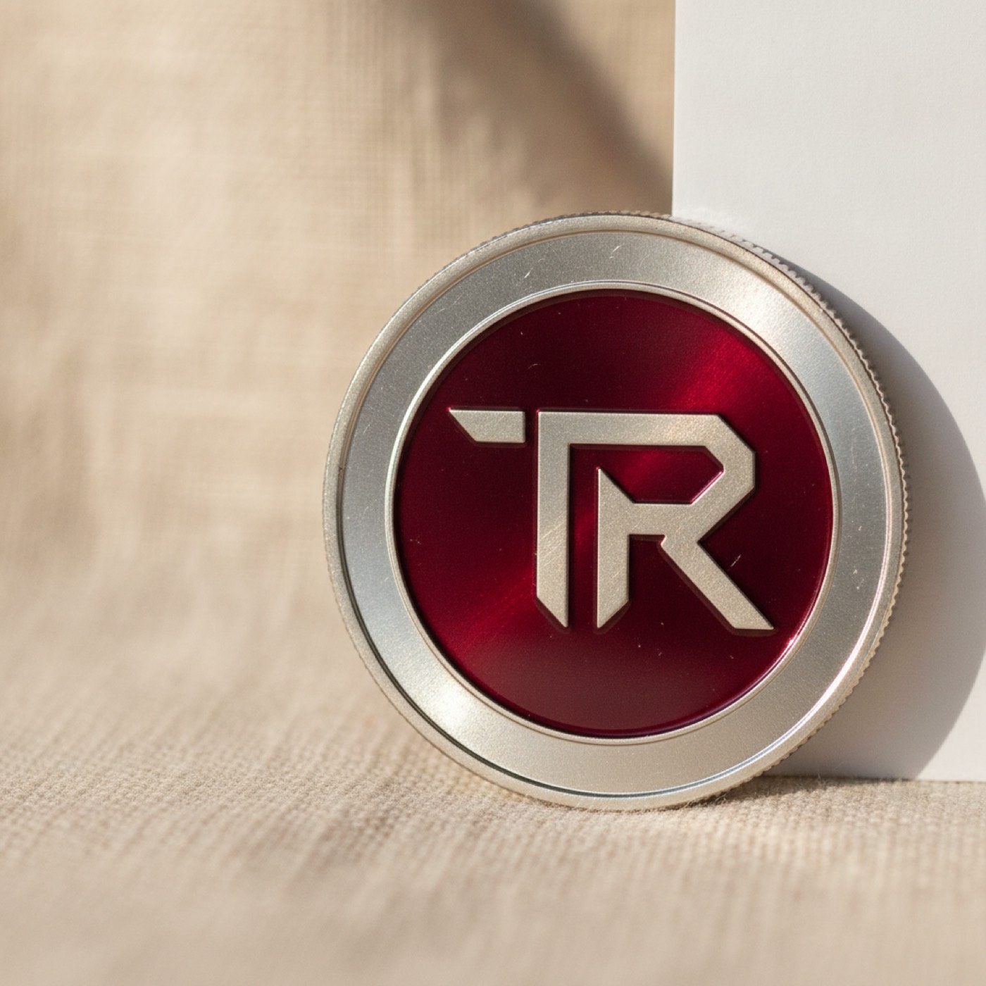 A TRON coin lying on a folded piece of natural linen cloth